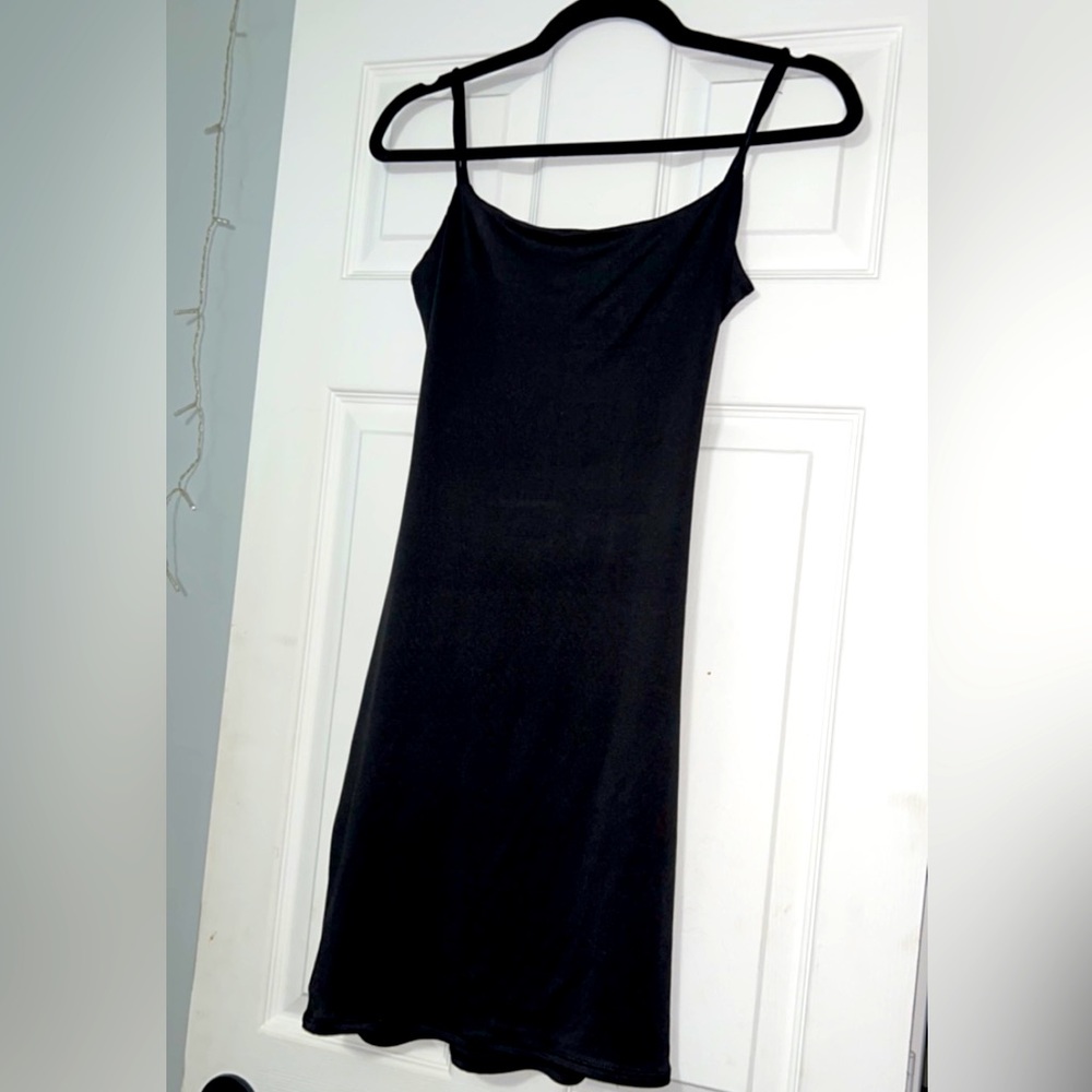 Brand new with tags; Heart & Hips size Large Black Dress with Criss Cross Back.